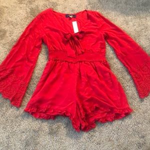 Red romper with front cut-out. Brand new!